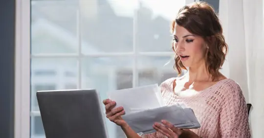 Woman checking utility bills
